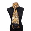 Black and gold silk scarf featuring an Art Nouveau print